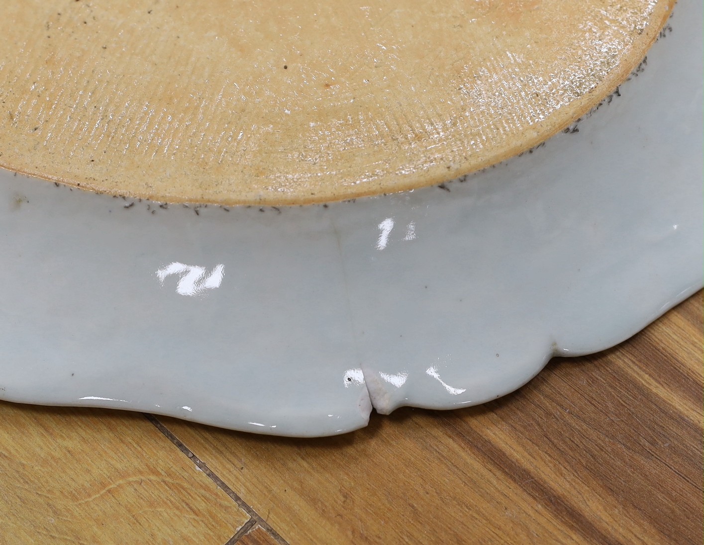 A pair of Chinese Famille Rose ‘peacock’ oval dishes, Qianlong period, 43cms wide